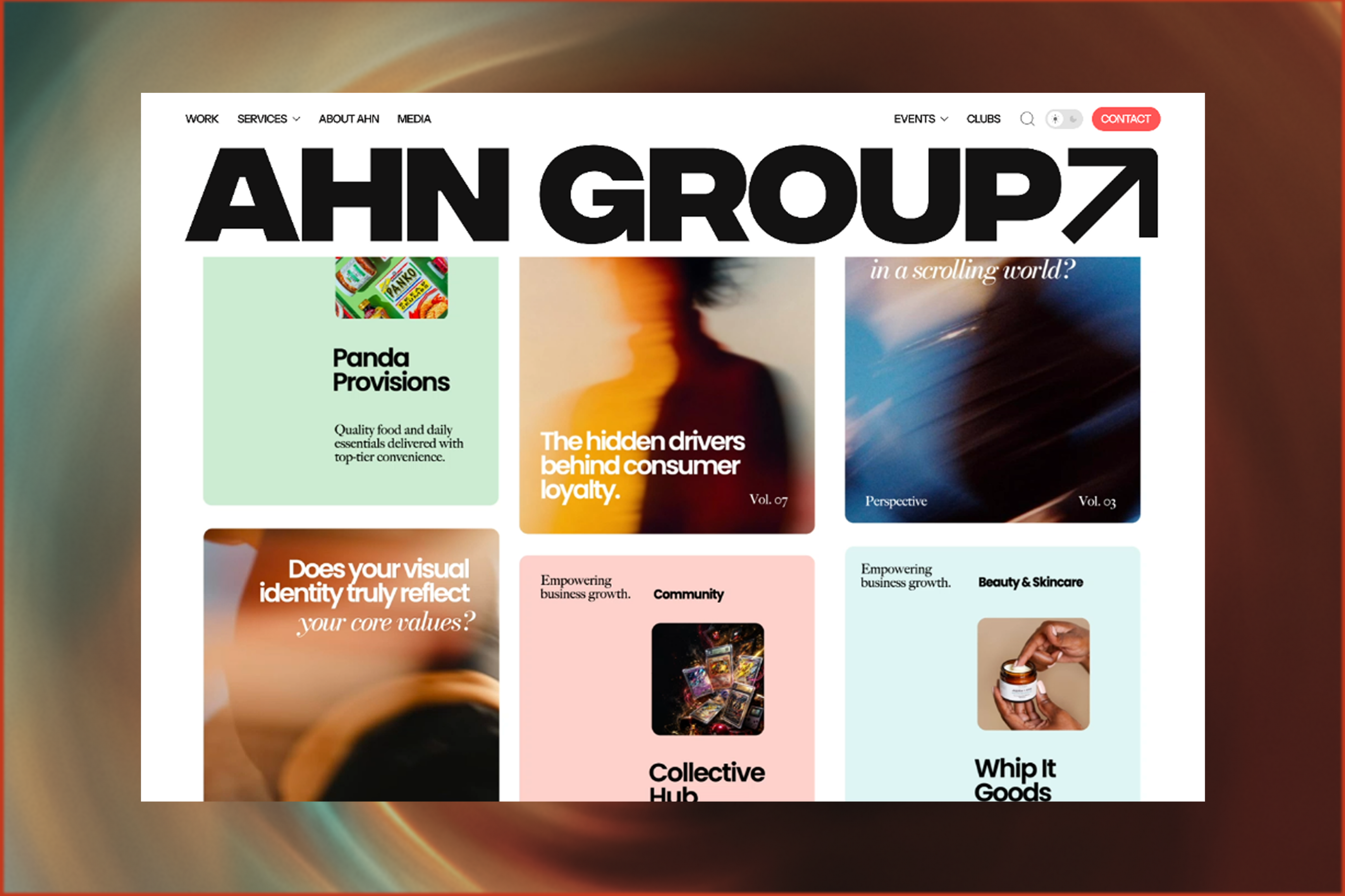 Browser window with the AHN Group website over a blurred warm ground